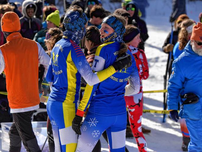 Mohawk Trail skiers celebrate  at the MIAA Nordic Ski Championships at Prospect Mountain in Woodford, Vt. on Wednesday.