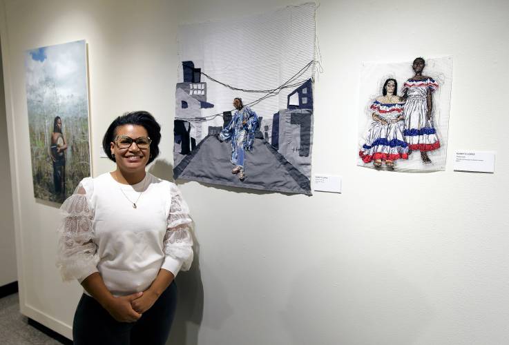 Kandy G Lopez, one of the 17 Florida-based artists who contributed to “As We Move Forward,” is seen by her two paint and fabric pieces, “Miyako in the City” and “Hispaniola.” 