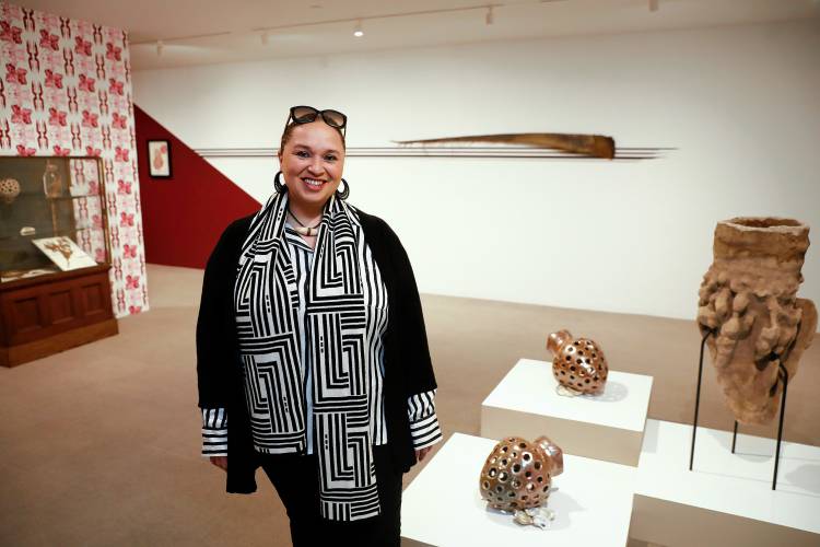 Shinnecock artist and filmmaker Courtney M. Leonard stands for a portrait at her exhibition “BREACH: Logbook 24 | Staccato” on Wednesday at the Umass Museum of Contemporary Art.