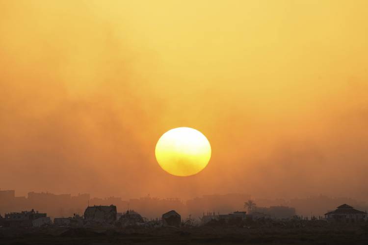 The sun sets over the Gaza Strip as seen from southern Israel, Monday, March 4, 2024.