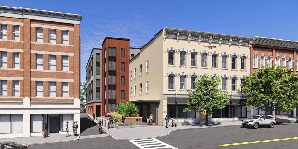 This rendering depicts what the former Hastings shop (white building) at 45 South Pleasant St. would look like when redeveloped into an Amherst College bookstore in the front and a five-story mixed-use building in the back.
