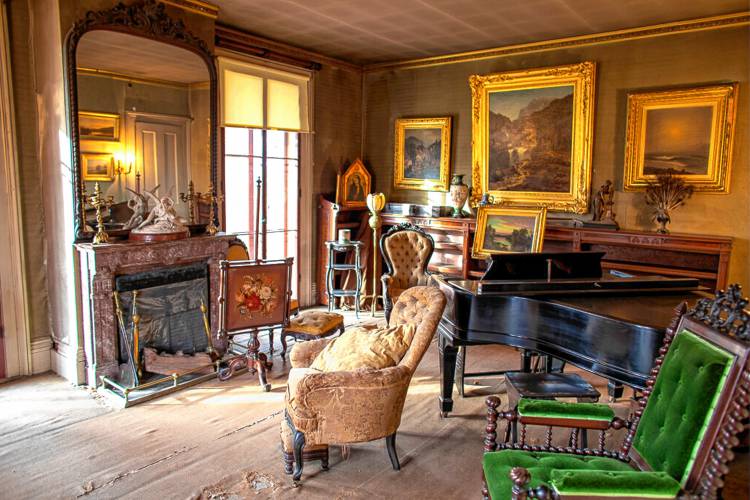 The parlor in The Evergreens at the Emily Dickinson Museum includes a number of 19-century paintings and furnishings. Emily Dickinson spent time here with her brother, Austin, and sister-in-law, Susan.
