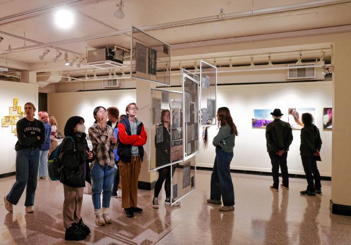 Guests explore the exhibit “As We Move Forward” during a recent reception at the Augusta Savage Gallery at UMass Amherst.