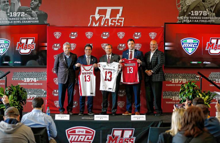 From left, UMass football head coach Don Brown, Chancellor Javier Reyes, MAC commissioner Dr. Jon Steinbrecher, Director of Athletics Ryan Bamford and men’s basketball coach Frank Martin during a press conference at the Martin Jacobson Football Performance Center last  Thursday on UMass joining the Mid-American Conference.