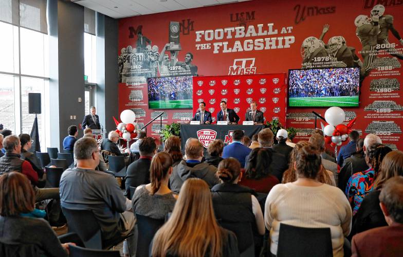 Chancellor Javier Reyes, from left, Director of Athletlics Ryan Bamford and MAC commissioner Jon Steinbrecher speak during a press conference at the Martin Jacobson Football Performance Center on Thursday regarding the University of Massachusetts joining the Mid-American Conference.
