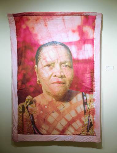 Diana Eusebio’s “Matriarca” includes a digital photo presented on quilted cotton fabric that’s dyed with powder made from Cochineal bugs.